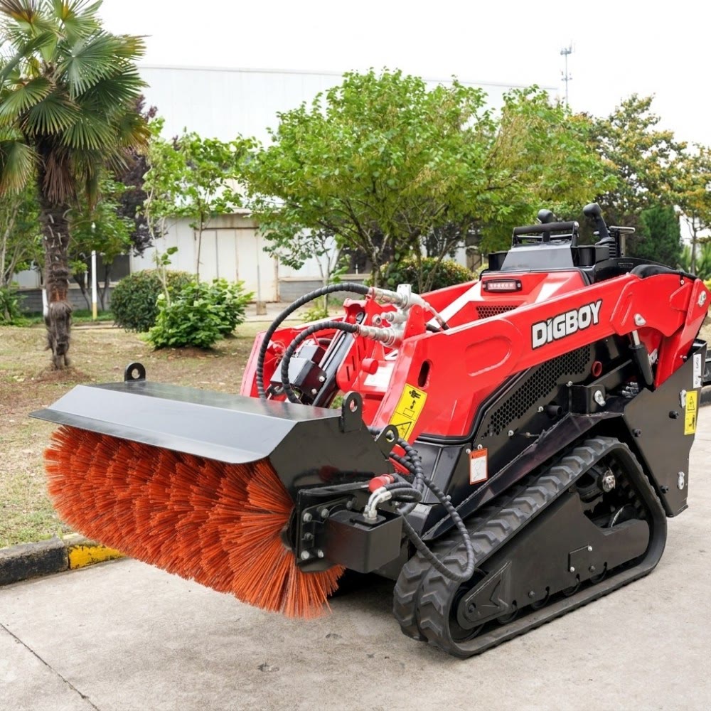 V1000 compact loader with sweeper attachment